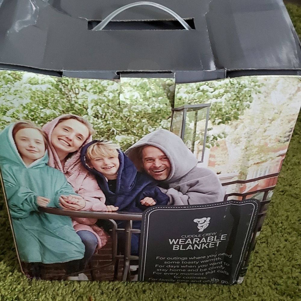 Soft light grey snuggly blanket new in box. Adult size. One size fits most.